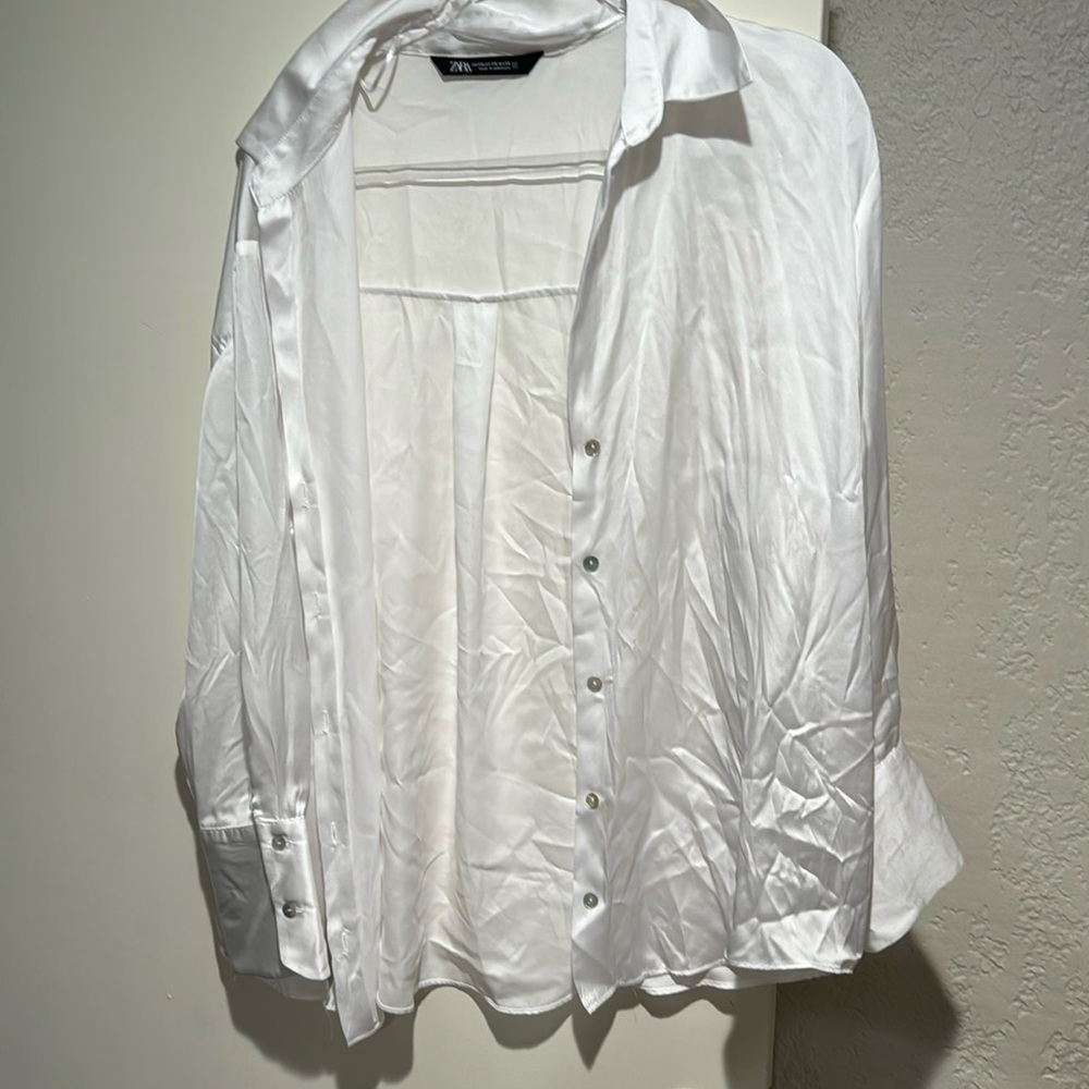 White silky button down shirt.